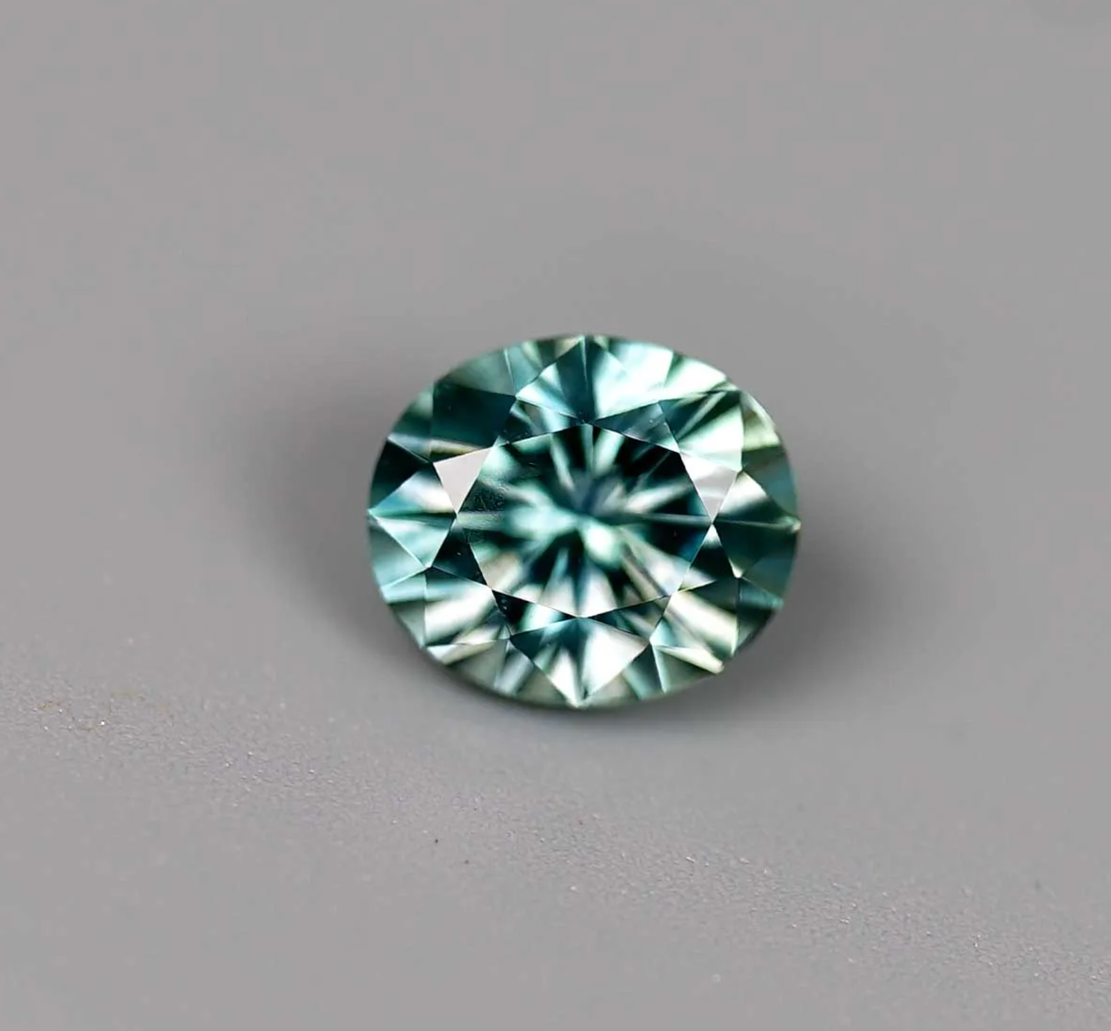 1.08CT OVAL BRILLIANT PRECISION CUT MONTANA SAPPHIRE, TEAL GREEN, 6.3X5.4mm