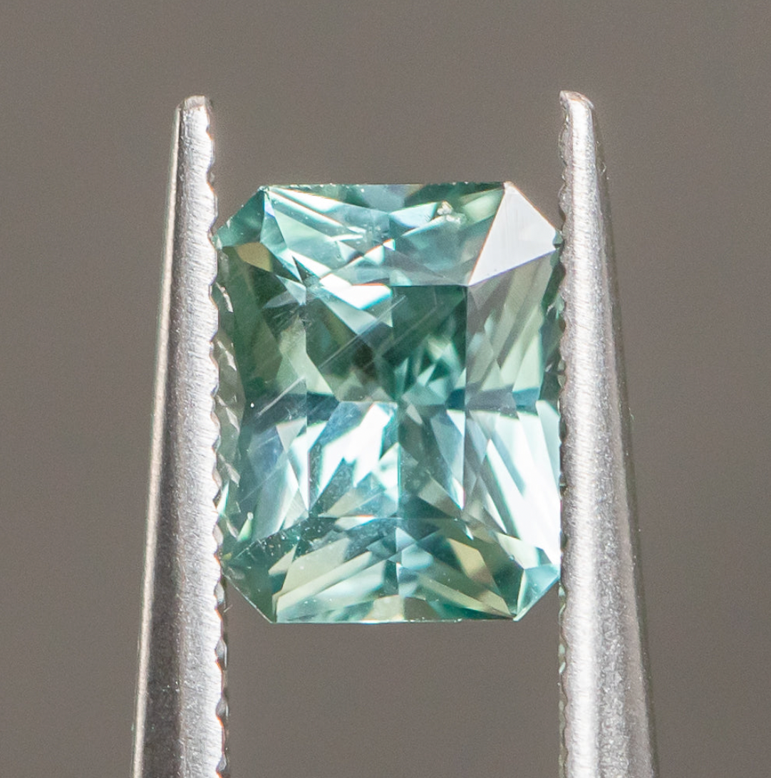 1.20ct Radiant Cut Seafoam Montana Sapphire Split Shank Bezel Ring with Milgrain in 14k Yellow Gold