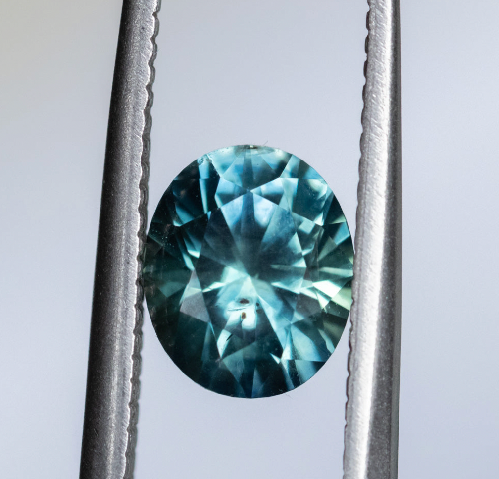 1.98ct Oval Precision Cut Teal Montana Sapphire and Princess Cut Diamond Rapids Low Profile Ring in 14k Yellow Gold